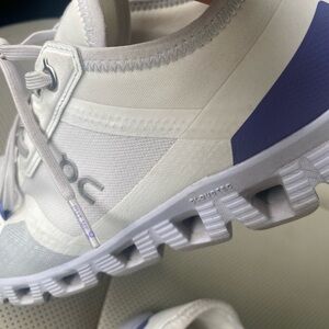 On Running White and Lavender Sneakers